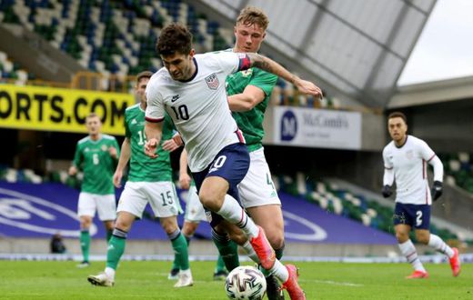 US winger Christian Pulisic (C) vies with Northern Ireland defender Daniel Ballard