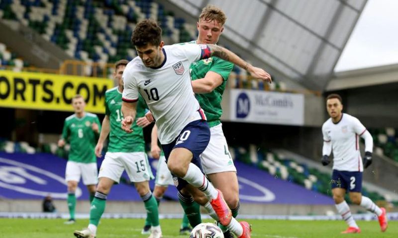 US winger Christian Pulisic (C) vies with Northern Ireland defender Daniel Ballard
