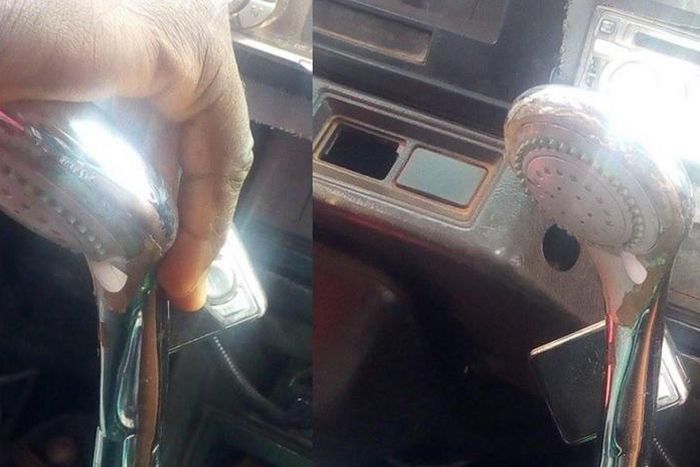 Trotro driver uses showerhead as a gear stick knob for the rickety vehicle