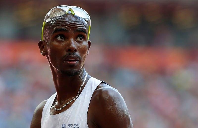 Mo Farah of Britain checks the scoreboard after the men's 5000 metres heats at the IAAF World Championships at the National Stadium in Beijing, China August 26, 2015. REUTERS/Lucy Nicholson