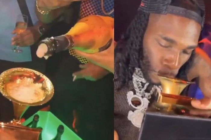 Burna Boy shows up in Nigerian club with Grammy plaque and drinks from it (WATCH)