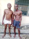 Suspected robbers pose for the cameras after being arrested by security operatives