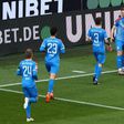 Man of the moment: Holstein Kiel defender Simon Lorenz (second right) celebrates his goal