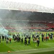 Supporters protesting against Manchester United's owners invaded the pitch at Old Trafford