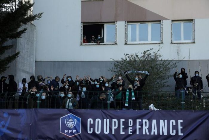 Seeing Red: Even though the match was played behind closed doors, Red Star fans found ways to cheer their tea to a cup victory over Lens