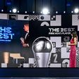 FIFA President Gianni Infantino (C-L) appears on a screen awarding 'The Best' men's player award to Bayern Munich striker Robert Lewandowski