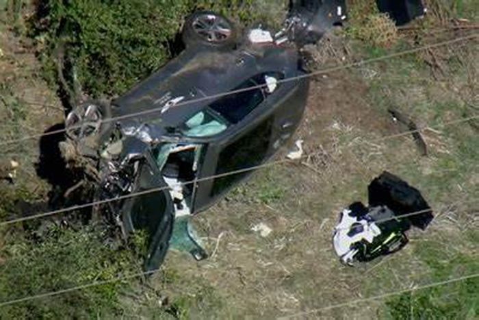 Mr. Woods was extricated from the wreck by local police