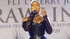 Adina tears down during emotional performance at Rawlings' vigil