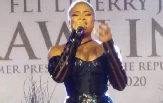 Adina tears down during emotional performance at Rawlings' vigil