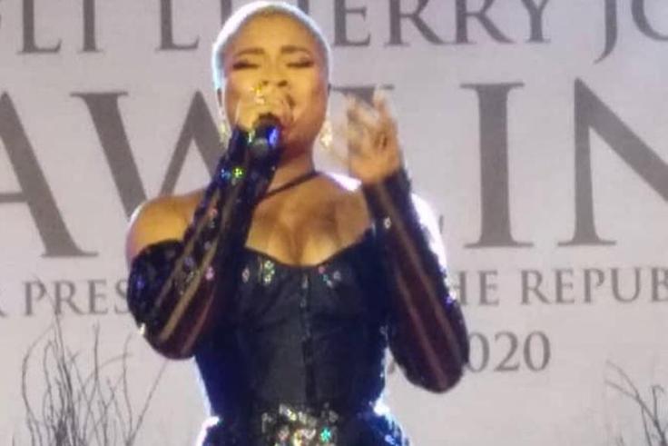 Adina tears down during emotional performance at Rawlings' vigil