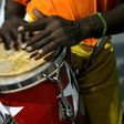 The dancing is accompanied by the five-step clave beat from African drums
