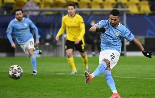 Manchester City midfielder Riyad Mahrez converts the second-half penalty against Dortmund