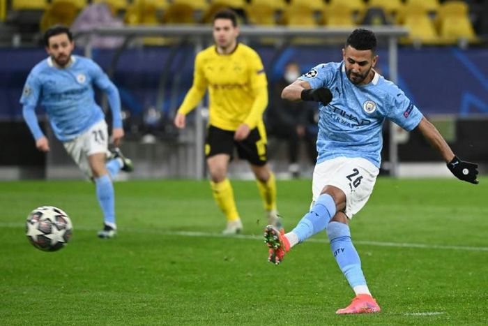 Manchester City midfielder Riyad Mahrez converts the second-half penalty against Dortmund