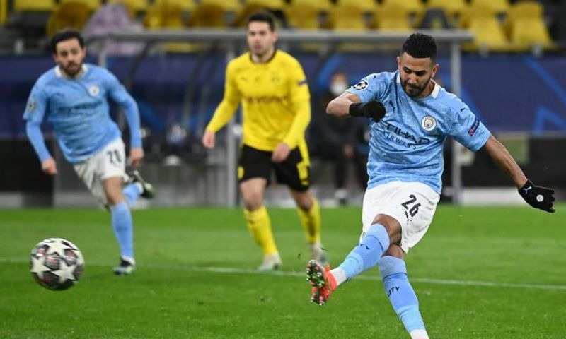 Manchester City midfielder Riyad Mahrez converts the second-half penalty against Dortmund