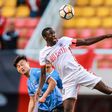 Jacob Mulenga (R) says he's owed hundreds of thousands of dollars after Liaoning Hongyun FC went bust