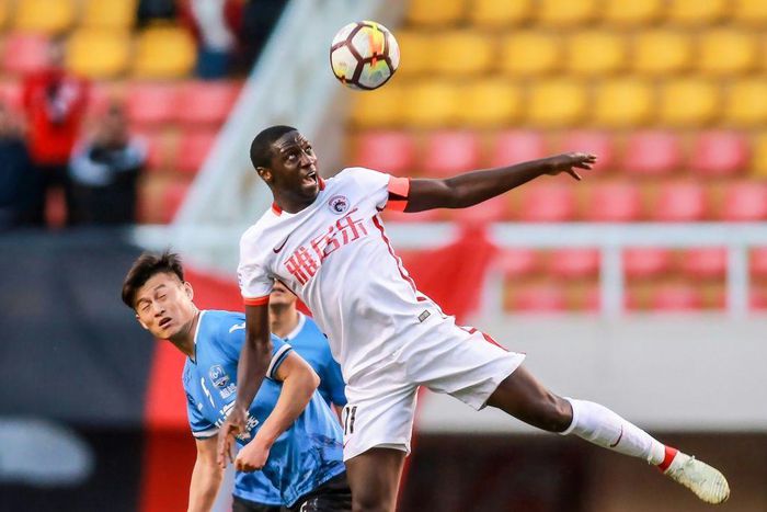 Jacob Mulenga (R) says he's owed hundreds of thousands of dollars after Liaoning Hongyun FC went bust