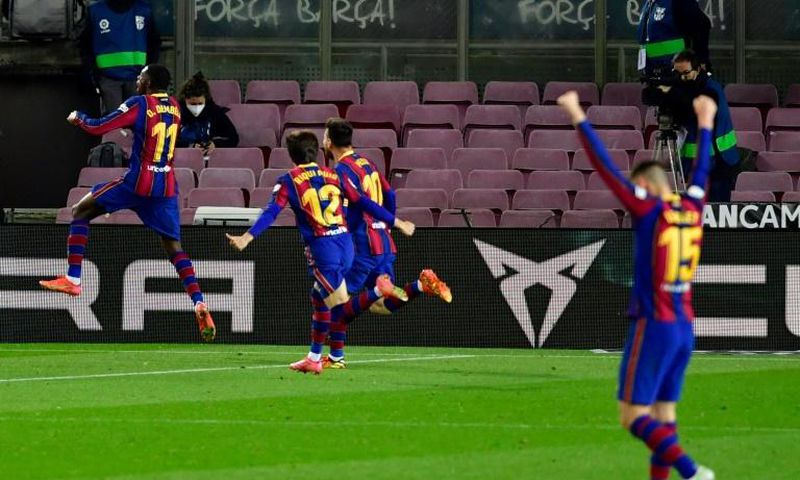 Ousmane Dembele (L) celebrates scoring the winner for Barcelona against Real Valladolid on Monday.