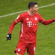 Bayern Munich striker Robert Lewandowski celebrates scoring a league-record 21 goals for the first half of the season
