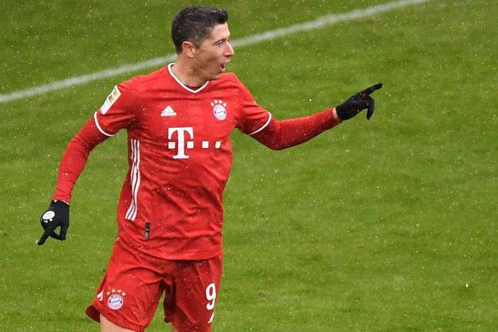Bayern Munich striker Robert Lewandowski celebrates scoring a league-record 21 goals for the first half of the season