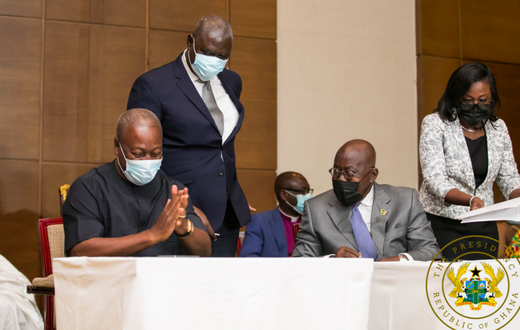 John Mahama and Akufo-Addo in a chit chat during signing of peace pact.