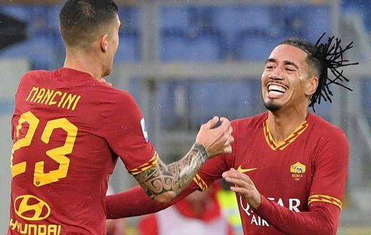 English defender Chris Smalling (R) joined Roma from Manchester United