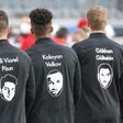 Frankfurt players wear shirts with names and portraits of victims of the Hanau shootings which took place one year ago
