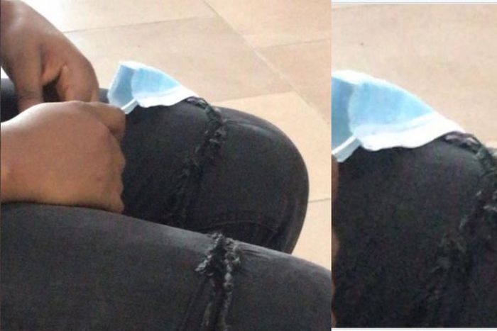 Lady given needle and thread to sew her ripped jeans before she obtains ID card