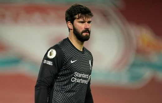 Cold feet: Alisson Becker made to mistakes leading to Manchester City goals in Liverpool's 4-1 defeat on Sunday