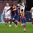Pique (2L) scored a dramatic equaliser against Sevilla