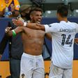 Shirtless  Jonathan dos Santos is congratulated by Los Angeles Galaxy teammate Javier Hernandez after scoring in the Galaxy's 2-1 Major League Soccer victory over Los Angeles FC