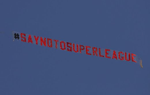 A plane flies above  Elland Road in Leeds before the Premier League game against Liverpool protesting against the planned Super League