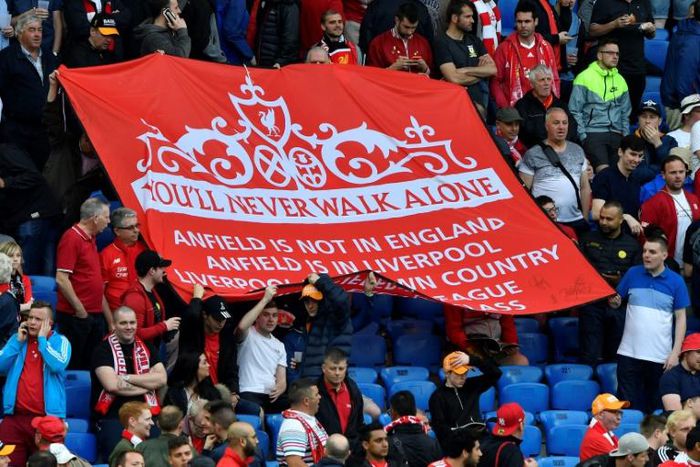 Anthem: Liverpool's supporters hold a banner reading "you'll never walk alone"