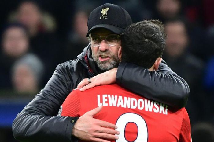 Liverpool manager Jurgen Klopp (L) embraces Bayern Munich forward Robert Lewandowski after a Champions League game in 2019