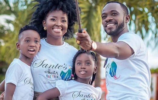 Okyeame Kwame with wife and children