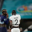 France midfielder Paul Pogba (left) speaks with Germany defender Antonio Ruediger during their Euro 2020 match in Munich