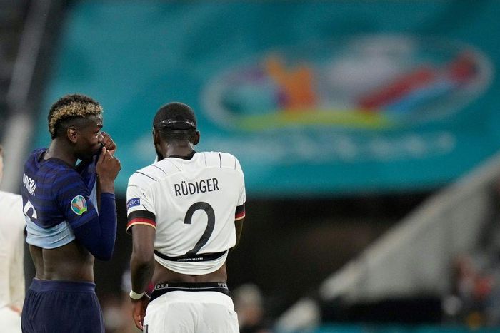 France midfielder Paul Pogba (left) speaks with Germany defender Antonio Ruediger during their Euro 2020 match in Munich