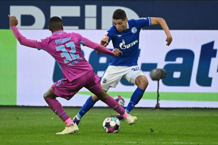 Moroccan international Amine Harit (R) of Schalke contests possession against Hoffenheim in the Bundesliga at the weekend.