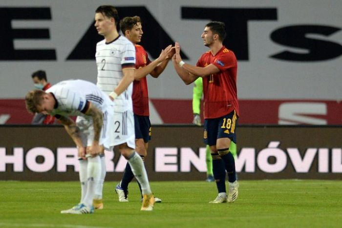 Ferran Torres (R) celebrates after completing his hat-trick in Spain's stunning 6-0 win over Germany
