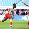 Amadou Haidara (L) celebrates scoring RB Leipzig's opening goal at home to Stuttgart on Sunday