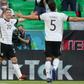 Robin Gosens (L) celebrates scoring Germany's fourth goal in Munich on Saturday at Euro 2020