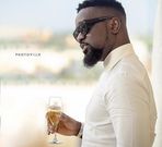 Sarkodie holding wine glass