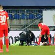 Worrying moment: Union Berlin goalkeeper Andreas Luthe and defender Julian Ryerson receive medical attention