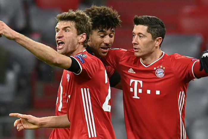 The men to beat: Bayern Munich's Robert Lewandowski, Thomas Mueller and Chris Richards celebrate a goal as they beat Salzburg for a 15th straight Champions League win