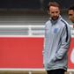 England manager Gareth Southgate (L) speaks with Liverpool defender Trent Alexander-Arnold