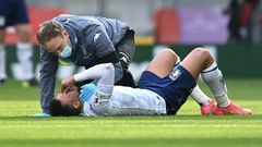 Injured - Aston Villa midfielder Trezeguet receives medical attention during a Premier League match against Liverpool at Anfield on Saturday