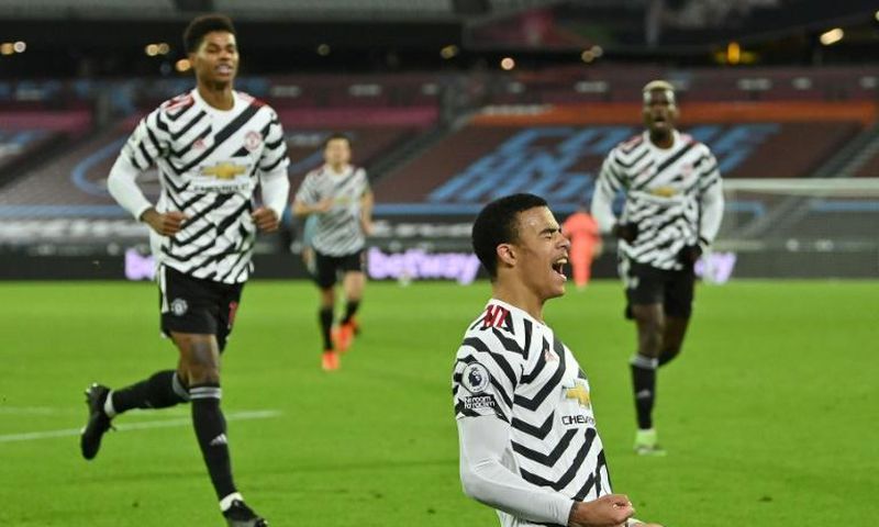 Mason Greenwood (centre)celebrates his first Premier League goal of the season