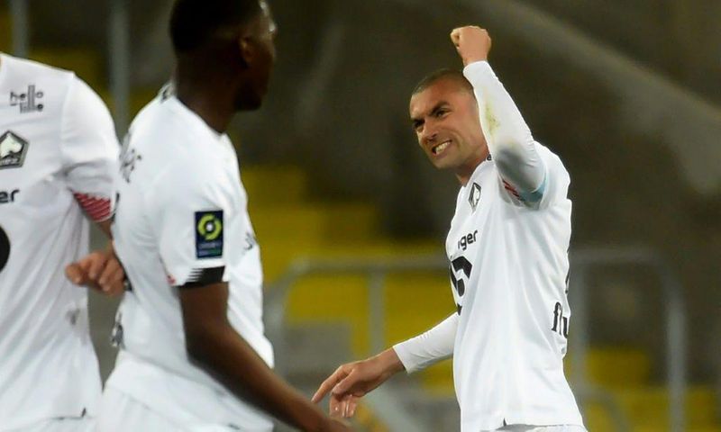 Burak Yilmaz celebrates his second goal as Lille in at Lens