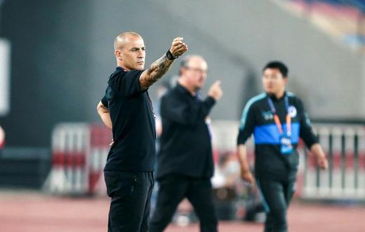 Former World Cup-winner Fabio Cannavaro (left) coaches at Guangzhou Evergrande and former Liverpool manager Rafael Benitez (centre) is in charge at Dalian Pro in the Chinese Super League