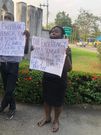 Nigerian magistrate & 2 sons protest over her 2 years' salary arrears