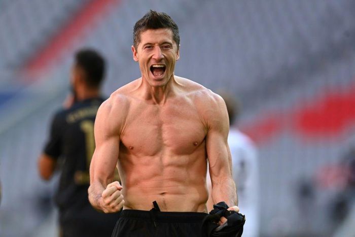 Bayern Munich striker Robert Lewandowski celebrates scoring a record 41st Bundesliga goal this season